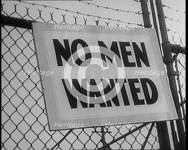 A Sign Hanging on a Fence. Sign Read: 'No Men Wanted', 1929. Creator: British Pathe Ltd.
