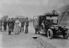 Queen Mary visits aerodrome shed, 5 Jul 1917. Creator: Bain News Service.