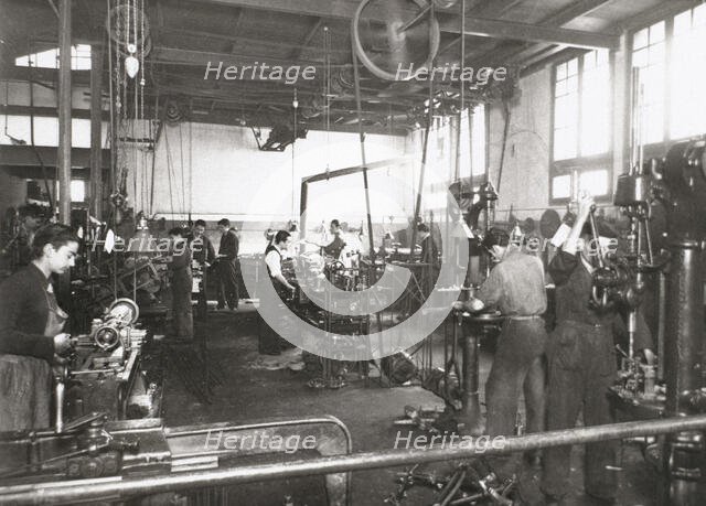 Production line of a company who manufacture motorcycle components, Barcelona, Spain, 1945.  Creator: Unknown.