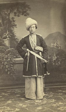 Full-length portrait of unidentified man in Georgian(?) dress, facing front, between 1870 and 1886. Creator: Unknown.