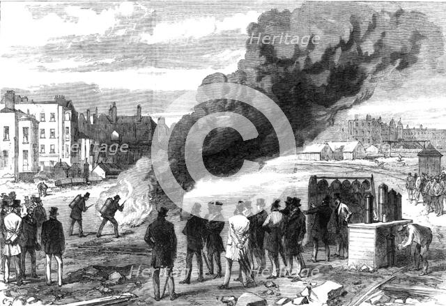 Experiments with l’Extincteur on the Thames Embankment before the Prince of Wales, 1868. Creator: C. R..