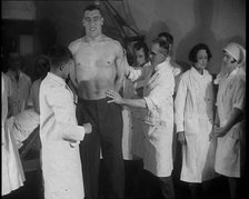 Doctors Checking the Physique of Primo Carnera, 1930s. Creator: British Pathe Ltd.