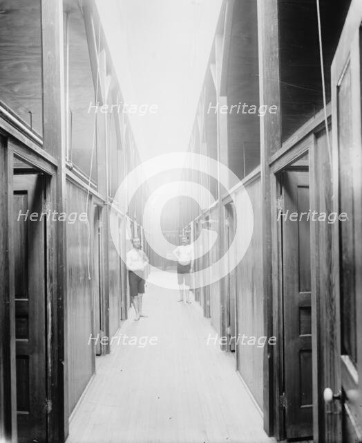 Two men in corridor, probably the Ypsilanti mineral bath house, Ypsilanti, Michigan, c1900-1910. Creator: Unknown.