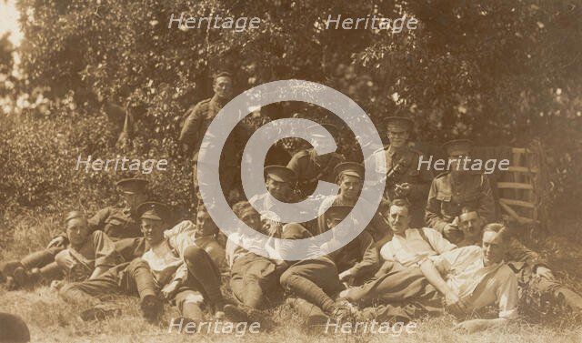 Soldiers relaxing in a field, (between 1910 and 1919?). Creator: Unknown.