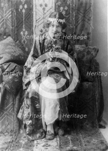 Neith Boyce Hapgood,full-length portrait, seated facing front, wearing..., between 1890 and 1910. Creator: Frances Benjamin Johnston.