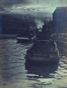 Rear view of tugboats approaching a wharf, possibly in Cleveland, Ohio, 1903. Creator: Unknown.