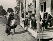 Haircutting in Front of General Store and Post Office on Marcella Plantation, Mileston, M..., 1939. Creator: Marion Post Wolcott.