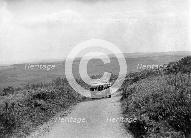 MG TA of GM Symmons competing in the MCC Torquay Rally, 1938. Artist: Bill Brunell.