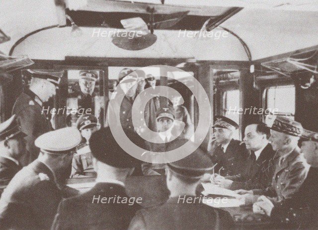 The German and French delegations inside a railroad car at Compiègne for the signing of France's sur Artist: Anonymous  
