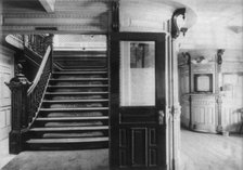 Interior view of steamboat showing stairway and pursers office, c1900. Creator: Frances Benjamin Johnston.