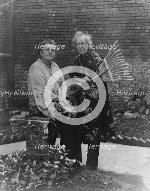 Frances B. Johnston in garden in New Orleans with "Pops" Whitesell, who is holding..., c1945 - 1952. Creator: Frances Benjamin Johnston.
