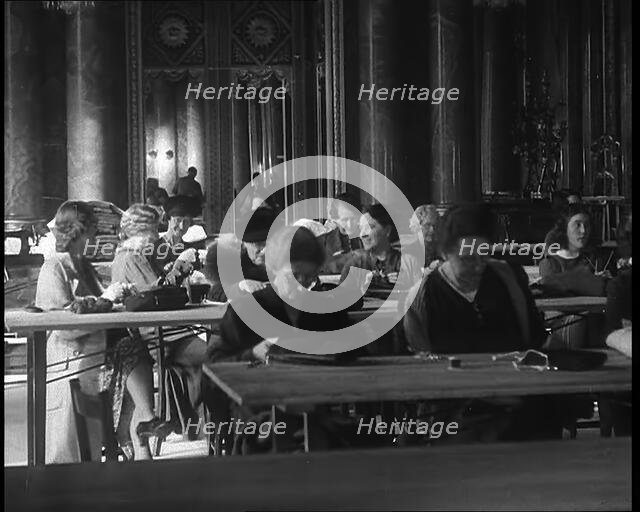 Buckingham Palace Hosting a Sewing Group. Large Numbers of Women Sewing or Knitting, 1940. Creator: British Pathe Ltd.