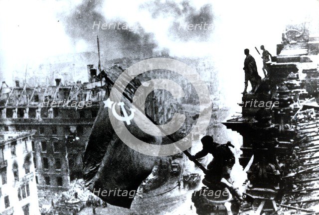 Raising a flag over the Reichstag, 2 May 1945. Artist: Yevgeny Khaldei