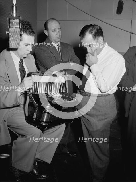 Portrait of Joe Mooney, Milt Gabler, and Morty Palitz, Decca studio, New York, N.Y., ca. Dec. 1946. Creator: William Paul Gottlieb.
