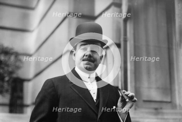 Chas. W. Murphy holding cigar, 1910. Creator: Bain News Service.