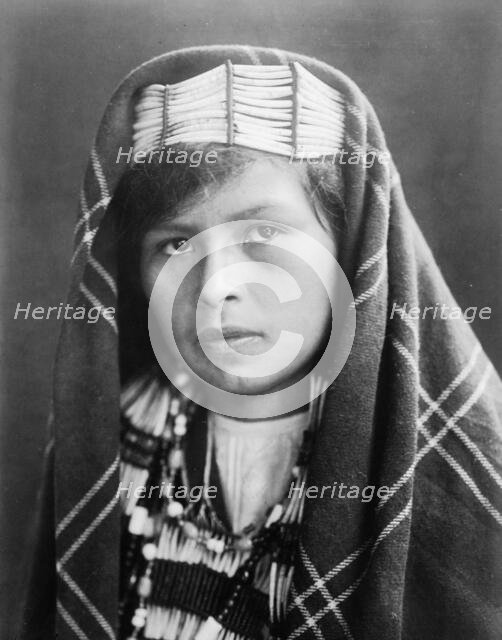 Quinault female head-and-shoulders portrait, facing slightly left, c1913. Creator: Edward Sheriff Curtis.