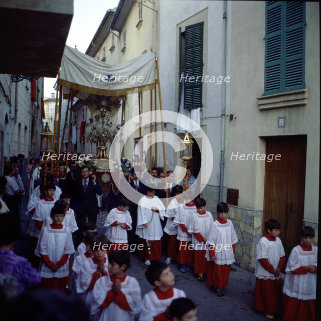 Procession of Corpus', altar boys and custody pass through the narrow streets of the town of Poll…