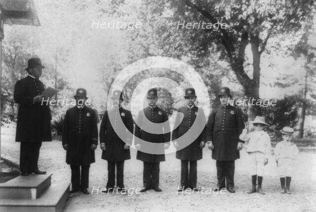 Archie and Quentin Roosevelt with White House policemen, c1902 June 17. Creator: Frances Benjamin Johnston.