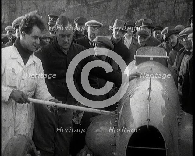 Malcolm Campbell Preparing his Car 'Bluebird' Watched By a Crowd of Civilians, 1927. Creator: British Pathe Ltd.