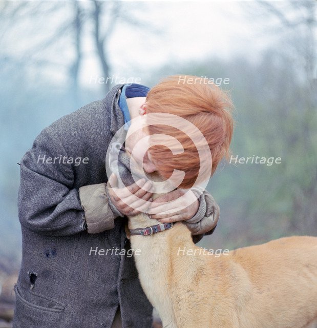 Gipsy boy with a dog, Charlwood, Newdigate area, Surrey, 1964.
