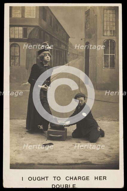 A shoeshine boy cleans the boots of a man in drag, c1905. Creator: Unknown.