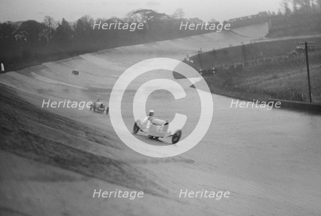 Two Bugattis racing at a BARC meeting, Brooklands, Surrey, 1931 Artist: Bill Brunell.