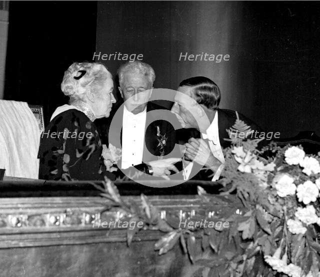 Selma Lagerlof with princes Eugen and Wilhelm, for her 80th birthday, the Dramaten, 1938.
 Creator: Unknown.