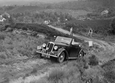 1937 Standard Twelve open 4-seater taking part in the NWLMC Lawrence Cup Trial, 1937. Artist: Bill Brunell.