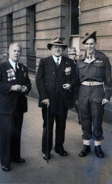 Captain Frank Page MC (centre), Anzac Day march, year unknown. Creator: Unknown.