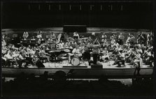 Buddy Rich and the Royal Philharmonic Orchestra in concert at the Royal Festival Hall, London, 1985. Artist: Denis Williams