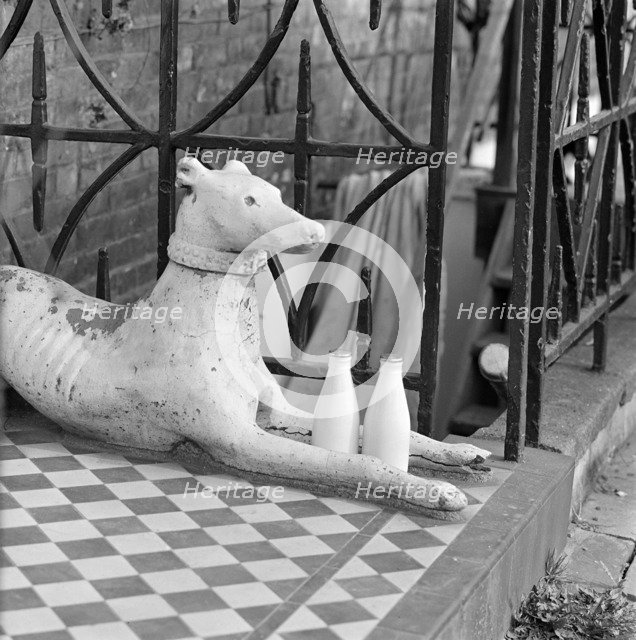 Stone greyhound and milk bottles, Duncan Terrace, Islington, London, 1962-1964. Artist: John Gay