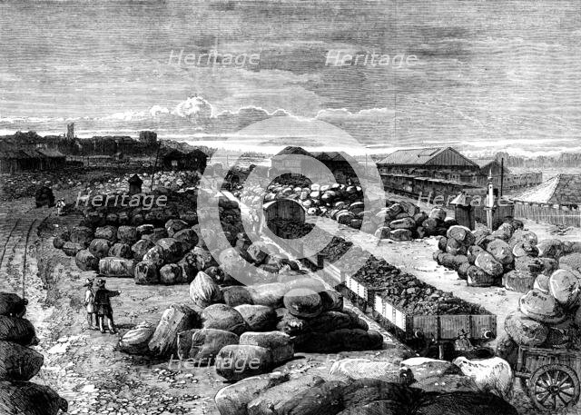 Cotton bales lying at the Bombay terminus of the Great Indian Peninsular Railway, 1862. Creator: Unknown.