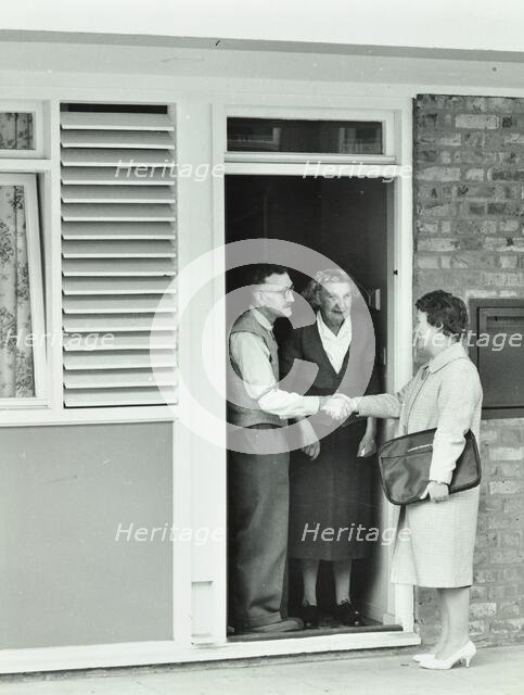 16 Candy Street, Poplar, London: elderly couple greet Welfare Officer, 1962. Creator: Unknown.