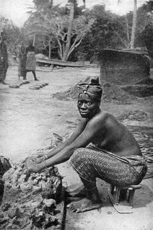 A Gold Coast potter and her clay, Ghana, West Africa, 1922.Artist: PA McCann