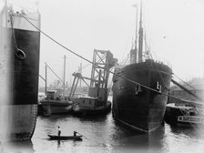 Loading steamers in Montreal harbor, between 1880 and 1901. Creator: Unknown.