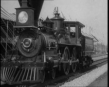 Old Locomotive Travelling Along the Tracks in Front of an Audience of Civilians in a Show..., 1920s. Creator: British Pathe Ltd.