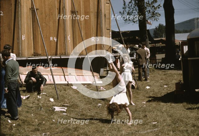 At the Vermont state fair, Rutland, "backstage" at the "girlie" show, 1941. Creator: Jack Delano.