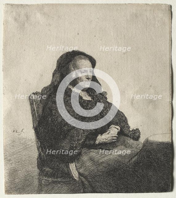 The Artist's Mother Seated at a Table, Looking Right: Three Quarter Length, c. 1631. Creator: Rembrandt van Rijn (Dutch, 1606-1669).