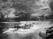 A Lancia Lambda being driven through water, c1925. Artist: Unknown