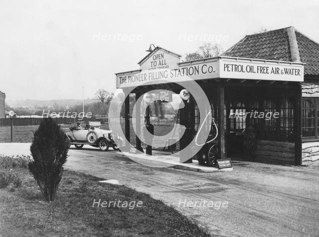 1923 Calcott 10hp at petrol station. Creator: Unknown.