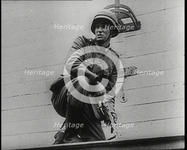A Male German Army Soldier Holding a Polish Eagle Emblem Removed from the Wall of a Warsaw..., 1939. Creator: British Pathe Ltd.