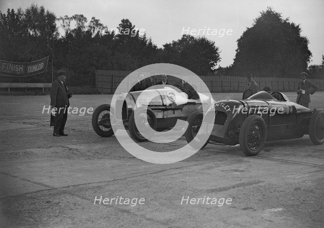 Delage of J Taylor and Bentley of Dudley Froy, Surbiton Motor Club race meeting, Brooklands, 1928. Artist: Bill Brunell.