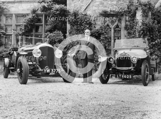 WO Bentley standing between two of his cars. Artist: Unknown