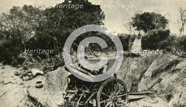 'A German Gun Position in the Heart of the Jungle: one of the 4.1 howitzers captured in East Africa' Creator: Unknown.