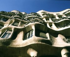 Façade of La Pedrera or Mila House, view from below, work of architect Antoni Gaudí i Cornet.