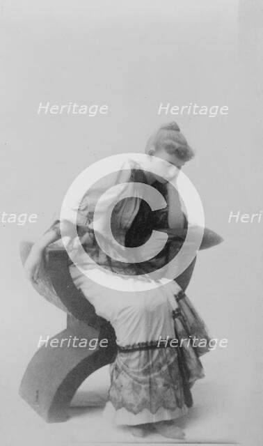 Frances Benjamin Johnston, full-length portrait, seated, facing left, looking..., c1880 - 1890. Creator: Unknown.