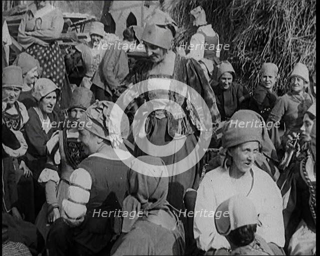 Crowds of Female Actors Wearing Period Costumes Drinking Beer Whilst Filming the German..., 1920s. Creator: British Pathe Ltd.