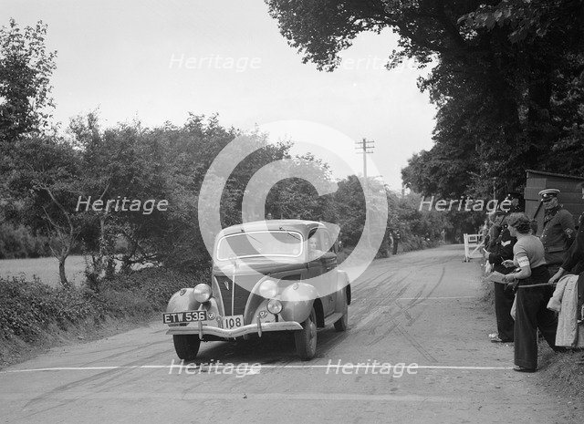Ford V8 of J McEvoy, winner of a bronze award at the MCC Torquay Rally, July 1937. Artist: Bill Brunell.