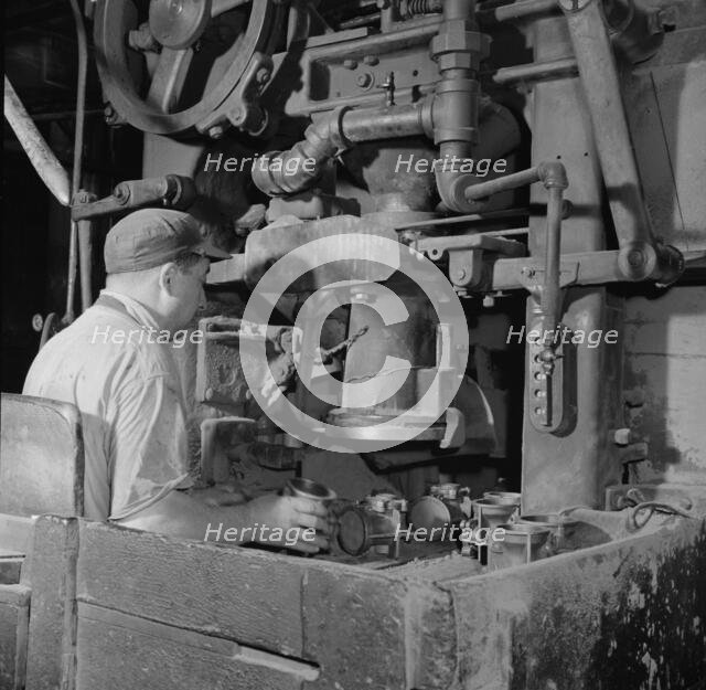 A core blowing machine, New Britain, Connecticut, 1943. Creator: Gordon Parks.