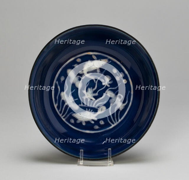 Dish with Fish Swimming in Lotus Pond, Ming dynasty (1368-1644), Wanli reign (1573-1620). Creator: Unknown.